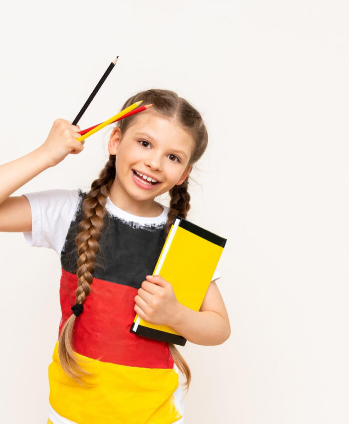 little-girl-with-german-flag-her-tshirt-holds-book-pencils-white-isolated-background-german-language-courses-schoolchildren